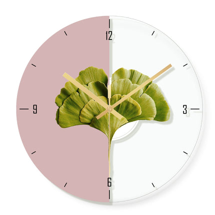 Moderne veggklokke med gyllent palmeblad