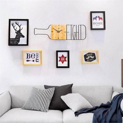 Veggklokke i tre med flaskedesign