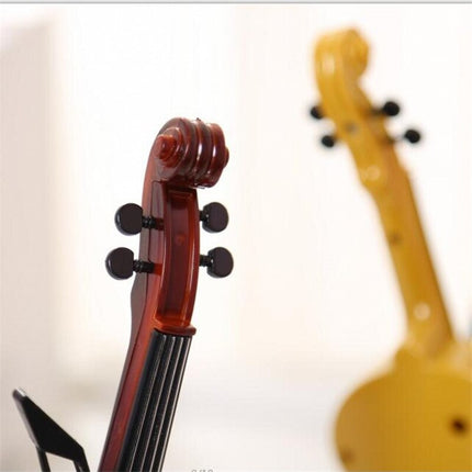 Dekorativ bordklokke formet som fiolin