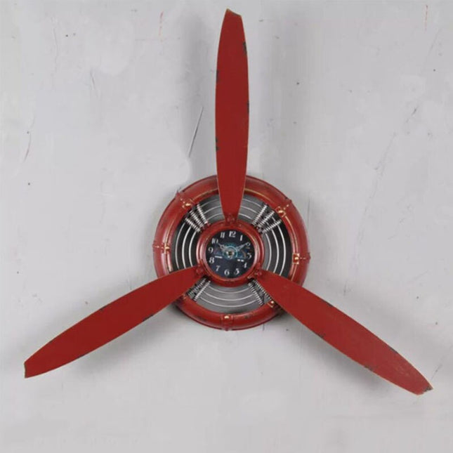 Industriell veggklokke formet som flypropell
