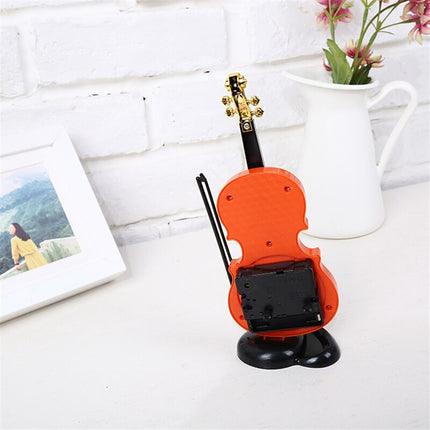 Dekorativ bordklokke formet som fiolin